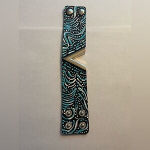 Hand painted one of a kind black and blue cuff bracelet with silver design.
